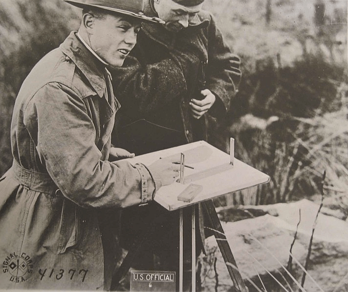 Image of an officer and soldier making maps in France, 1917-1918.